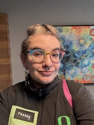 A woman smiles at the camera