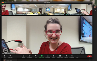 A Zoom screenshot of a 360 camera with a smiling woman
